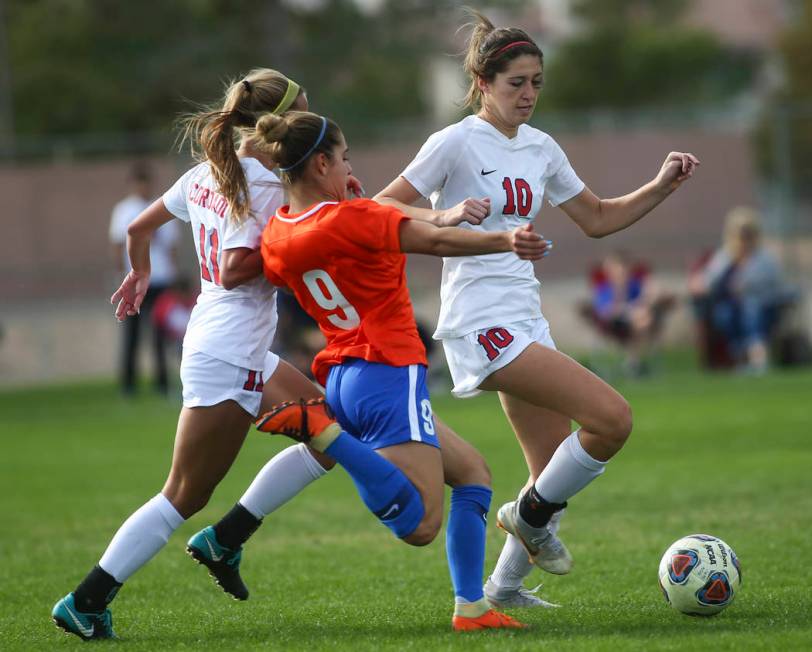 Bishop Gorman’s Jaden Terrana (9) tries to get the ball from Coronado’s Kaitlyn ...