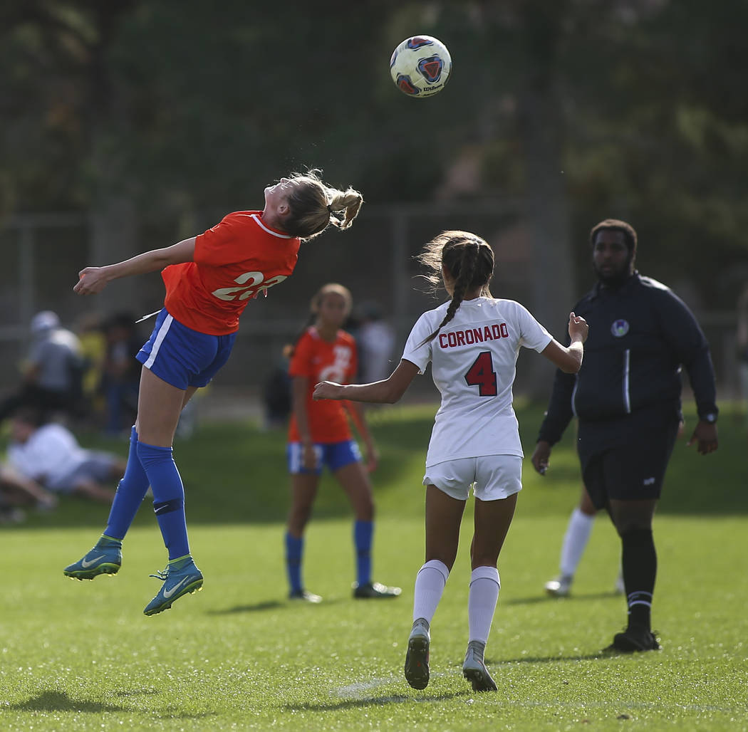 Bishop Gorman’s Jacqueline Hillegas (23) heads the ball past Coronado’s Chrysta ...