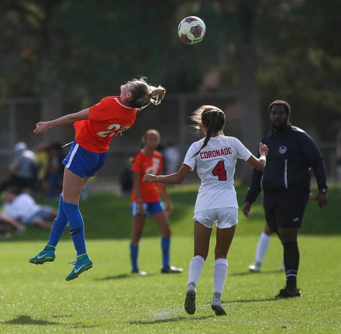 Bishop Gorman’s Jacqueline Hillegas (23) heads the ball past Coronado’s Chrysta ...