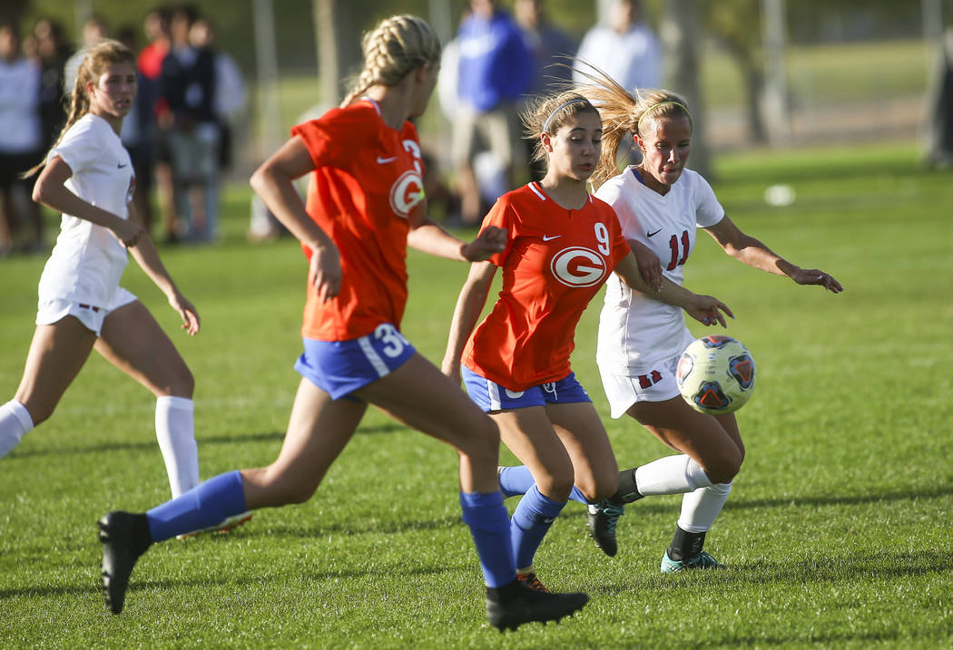 Bishop Gorman’s Jaden Terrana (9) moves the ball in front of Coronado’s Heather ...