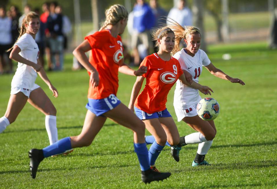 Bishop Gorman’s Jaden Terrana (9) moves the ball in front of Coronado’s Heather ...