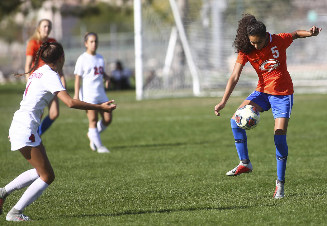 Bishop Gorman’s Samantha Nieves (5) kicks the ball past Coronado during the Desert Reg ...