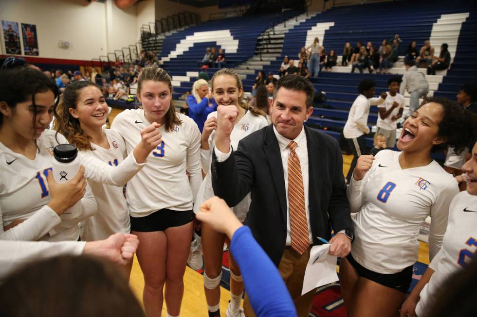 Bishop Gorman coach Gregg Nunley, center, celebrates with his team after their victory 3-0 a ...