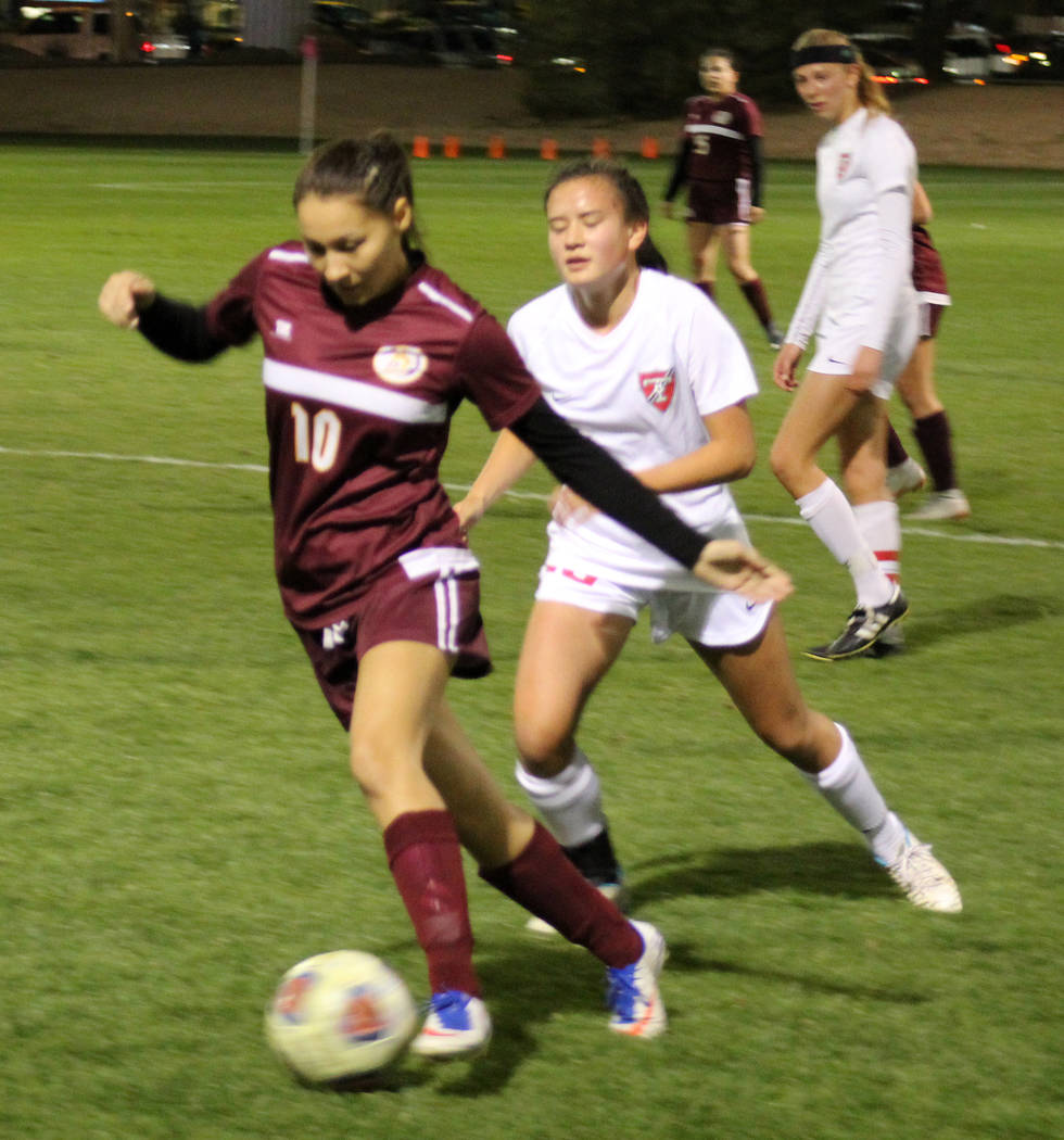 Pahrump Valley’s Sofia Castro dribbles past Truckee’s Carly Davis in the Class 3 ...