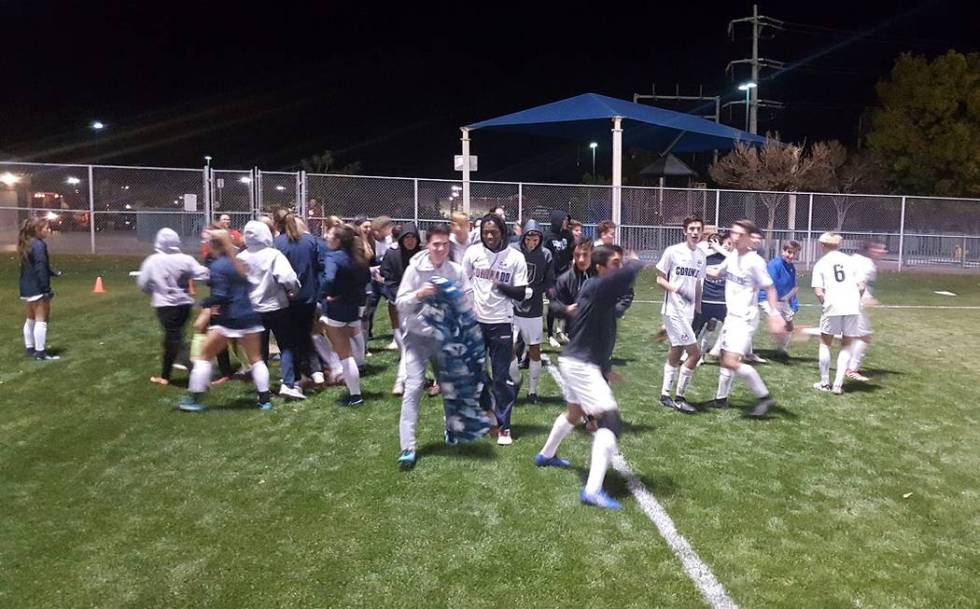 Coronado boys and girls soccer teams celebrates Javier Estrada’s game-winning goal aga ...