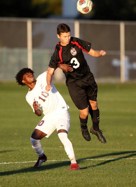 Durango’s Tyson Tesfamariam (10) and Las Vegas’ Carlos Sanchez (3) battle for th ...