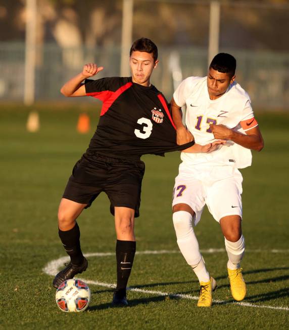 Las Vegas’ Carlos Sanchez (3) and Durango’s Marcos Delgado (17) battle for the b ...