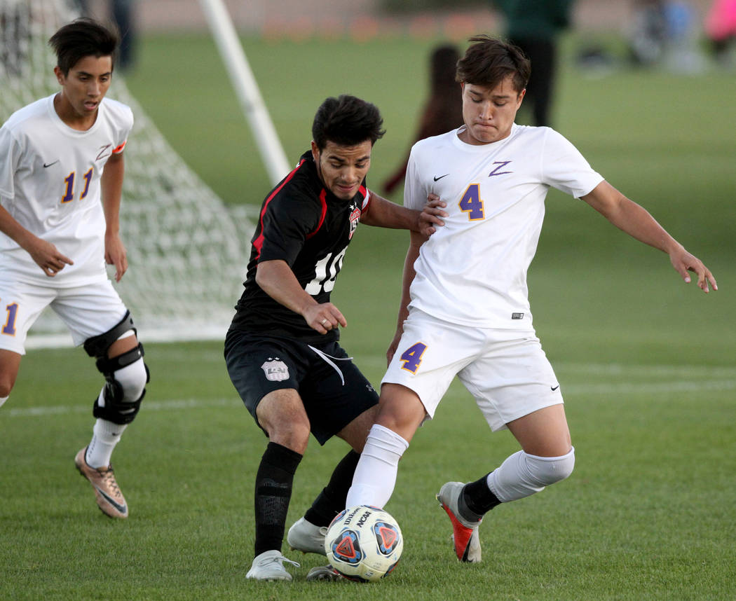 Las Vegas’ Fernando Gomez (10) and Durango’s Gael Delangel-Parra (4) battle for ...