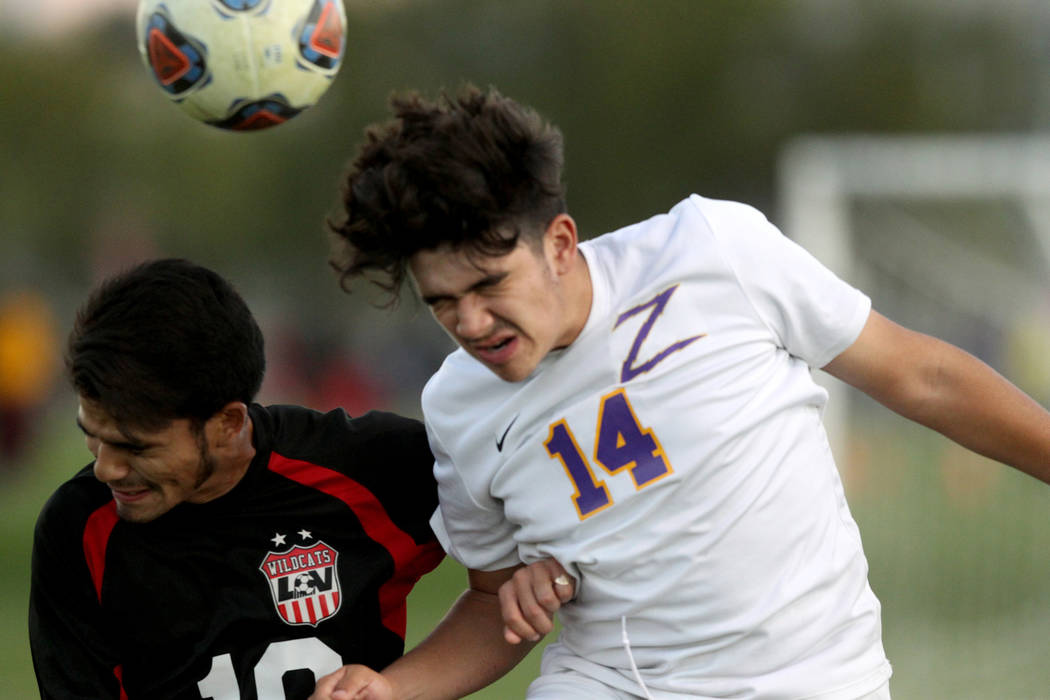 Las Vegas’ Fernando Gomez (10) and Durango’s Cristian DeLeon-Morales (14) battle ...