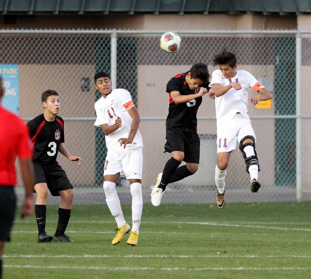 Las Vegas’ Sebastian Contreras (5) and Durango’s Christopher Bramasco (11) battl ...