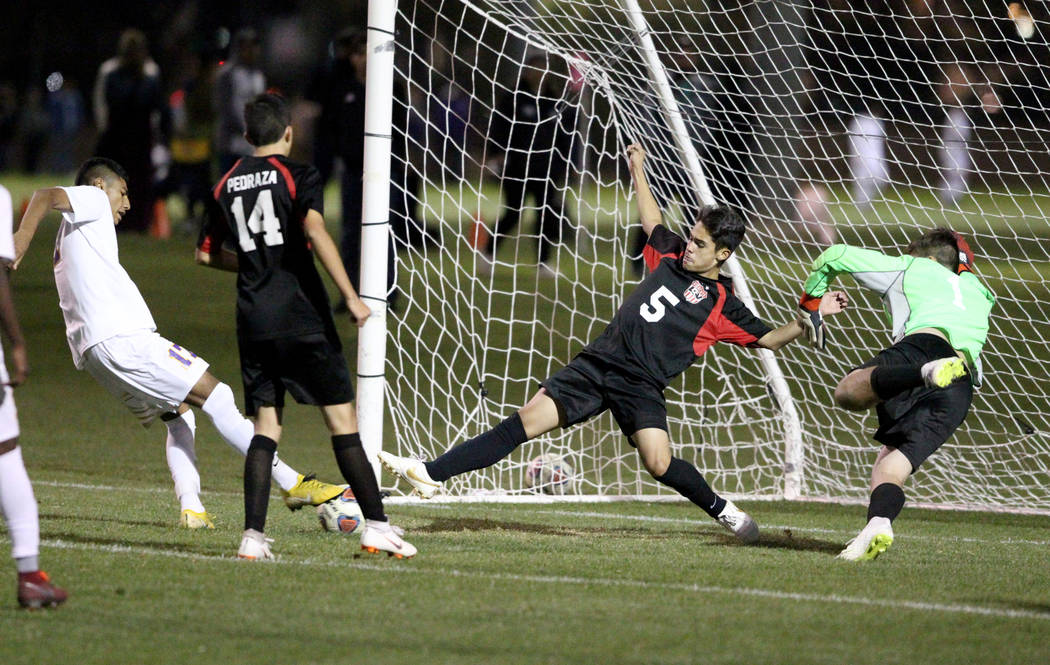 Las Vegas’ Sebastian Contreras (5) helps goalie Rodolfo Gomez (1) save a shot by Duran ...