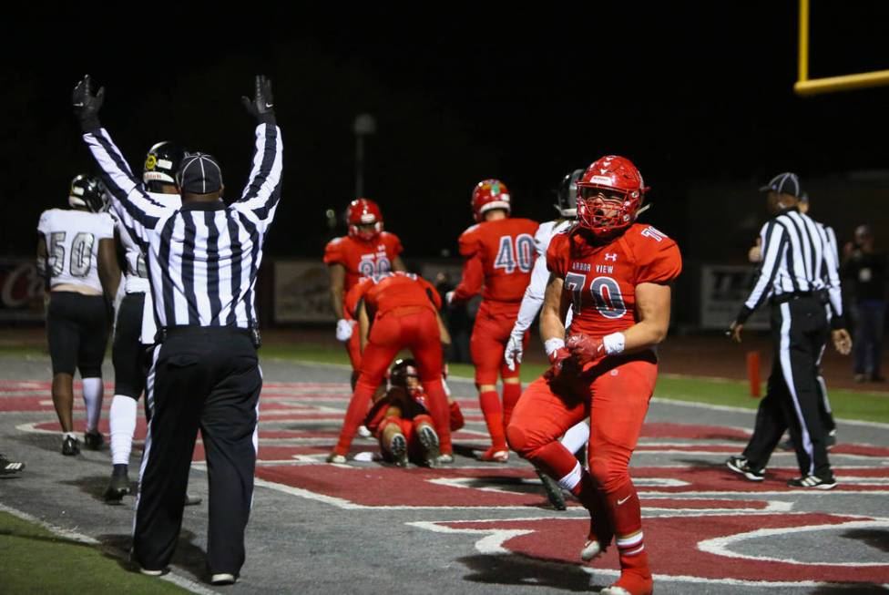 Arbor View’s Tyler Kincheloe (70) celebrates after Arbor View’s Logan Bollinger ...