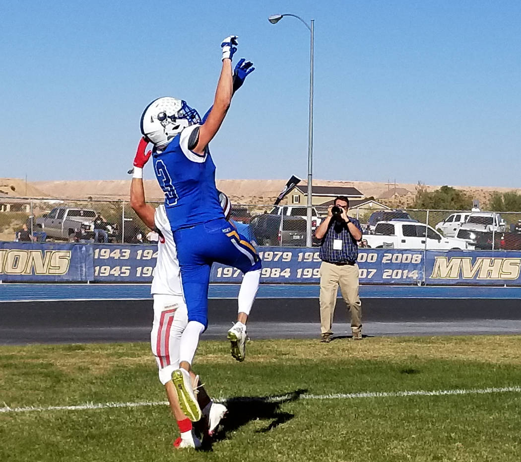 Moapa Valley’s Josh Cox leaps to catch a 7-yard touchdown pass on Saturday, Nov. 10, 2 ...