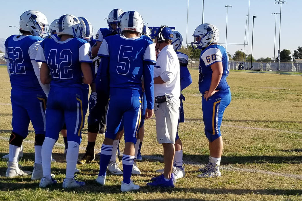 Moapa Valley coach Brent Lewis talks to his players during a timeout on Saturday, Nov. 10, 2 ...