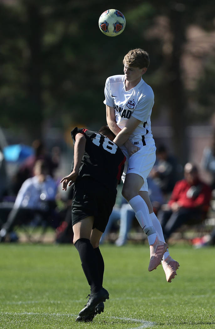 Las Vegas’ Sergio Aguayo (18) is fouled by Coronado’s Kealan O’Toole (4) d ...