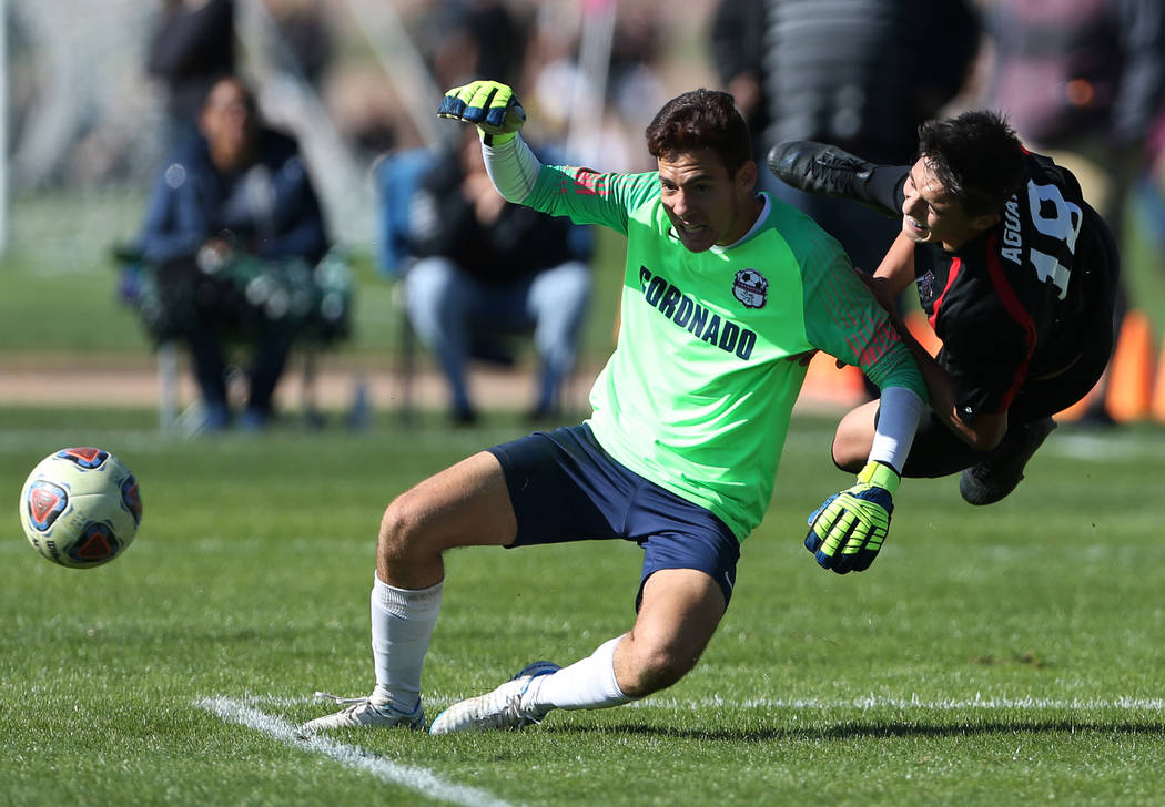 Las Vegas’ Sergio Aguayo (18) takes a fall during the second half against Coronado in ...