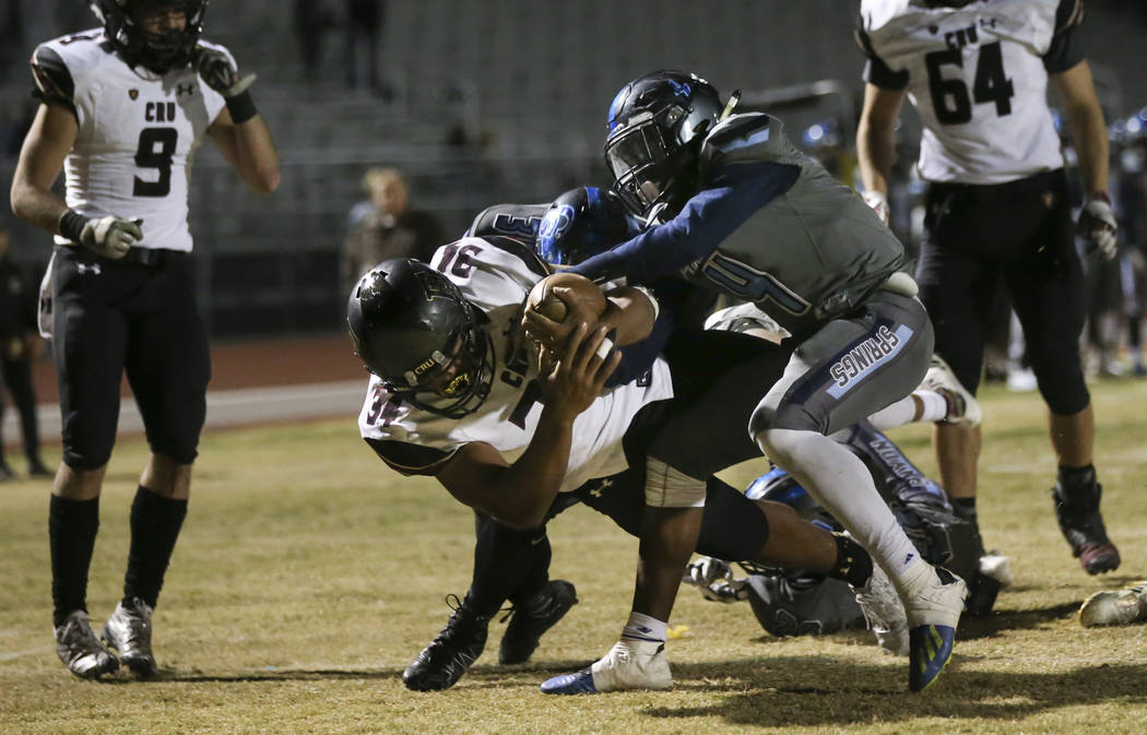 Faith Lutheran’s Kendall Lightfoot (34) dives into the end zone to score a touchdown u ...