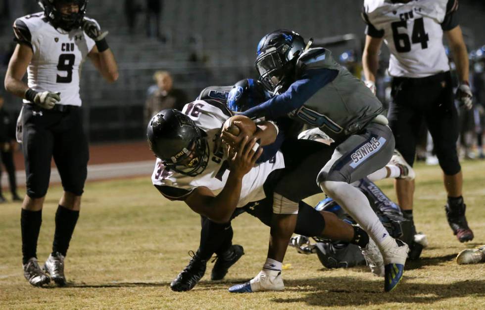 Faith Lutheran’s Kendall Lightfoot (34) dives into the end zone to score a touchdown u ...