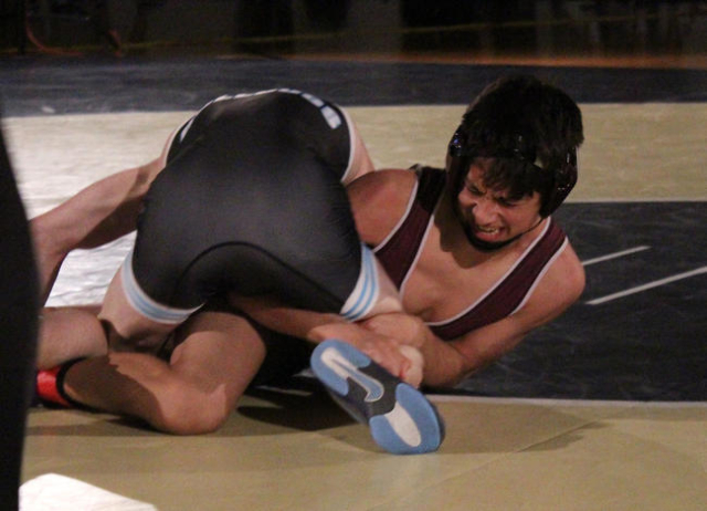 Cimarron-Memorial‘s Nathaniel Rodriguez clutches Centennial‘s Ryan Pierce‘ ...