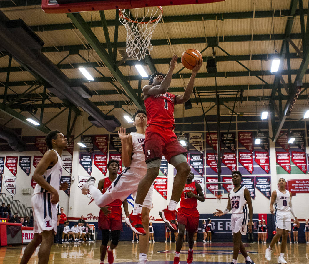 Coronado’s Jaden Hardy (1) goes up for a shot while other players watch during game ag ...