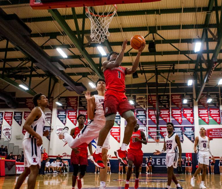 Coronado’s Jaden Hardy (1) goes up for a shot while other players watch during game ag ...