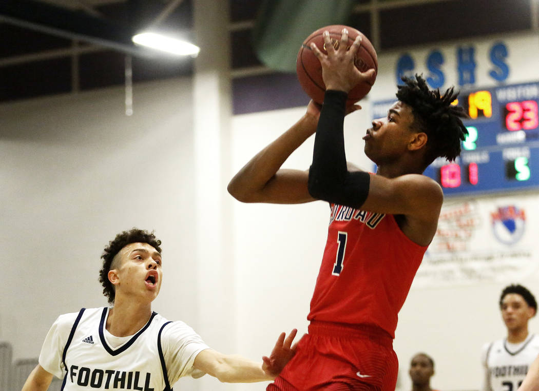 Coronado’s Jaden Hardy (1) shoots against Foothill’s Jace Roquemore (22) during ...