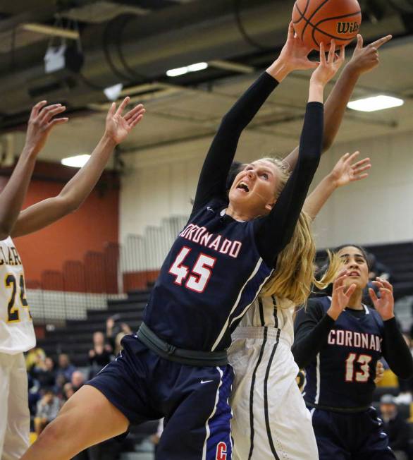 Coronado’s Haley Morton (45) reaches for the ball during a basketball game at Clark Hi ...