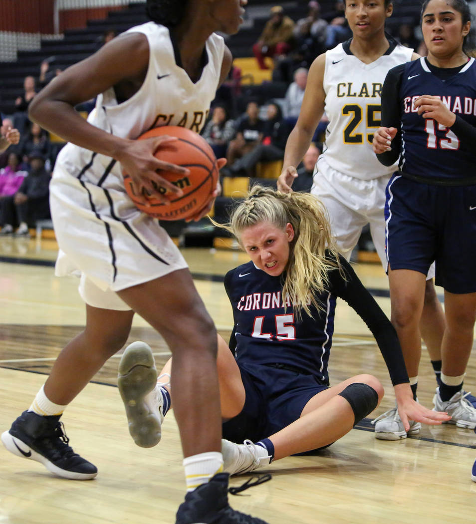 Coronado’s Haley Morton (45) falls back on the ground while Clark’s Al’ynn ...