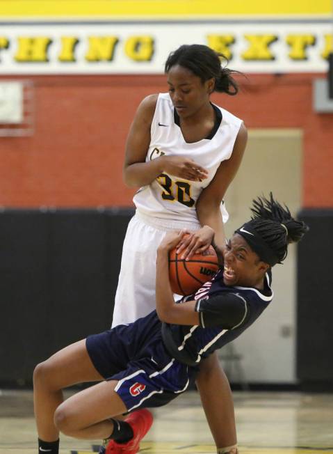 Coronado’s Tia Thornton (11) fights for the ball against Clark’s Julia Reid (30) ...