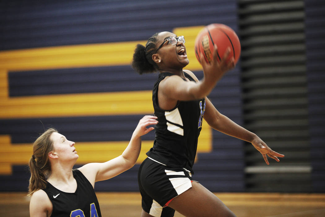 Shania Harper (12), a senior forward on the Sierra Vista High School varsity basketball team ...