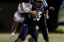 Liberty High’s defensive end Luke Toomalatai (44) tackles Foothill’s High quarte ...