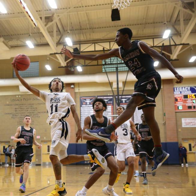 Democracy Prep’s Justous Harvey (11) goes up for a shot against Cimarron-Memorial&#821 ...