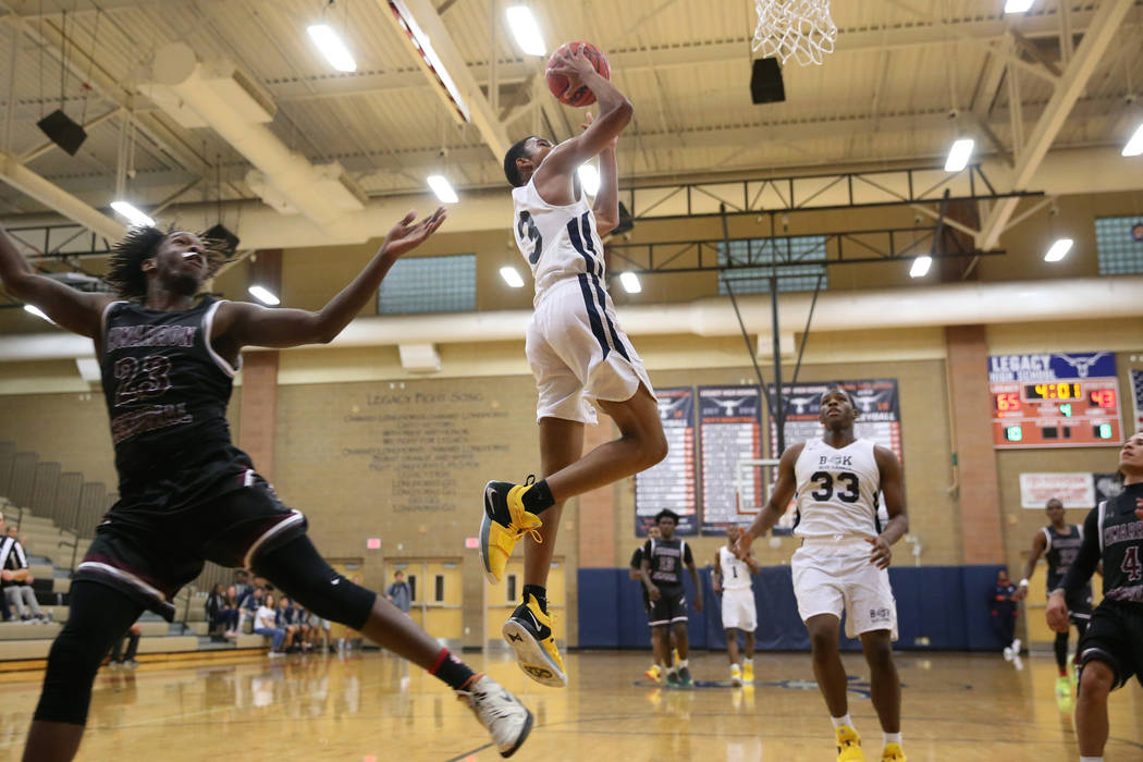 Democracy Prep’s Chancelor Johnson (3) goes up for a shot against Cimarron-Memorial&#8 ...