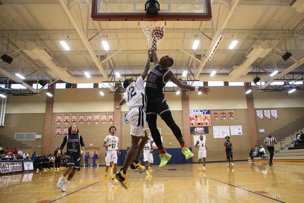 Cimarron-Memorial’s Makhi Walker (22) drunks the ball against Democracy Prep’s E ...