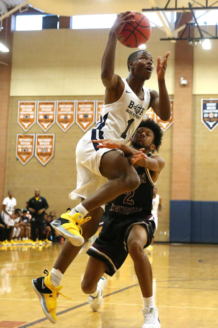 Democracy Prep’s Najeeb Muhammad (1) goes up for a shot against Cimarron-Memorial&#821 ...