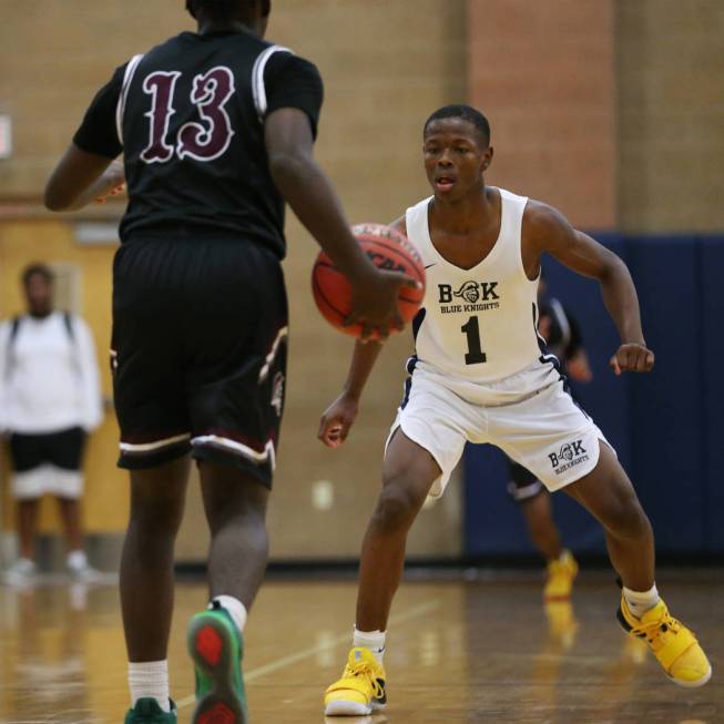 Democracy Prep’s Najeeb Muhammad (1) defends against Cimarron-Memorial’s Brian L ...