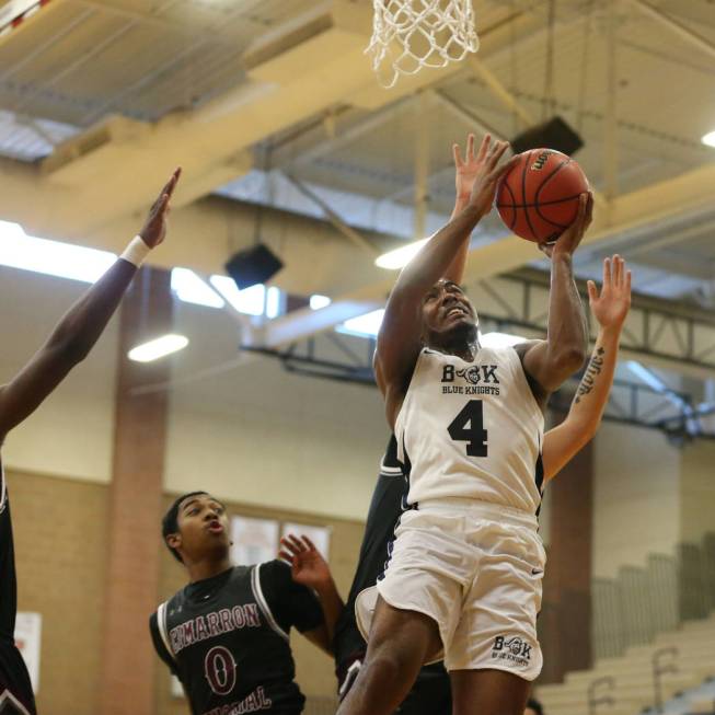 Democracy Prep’s Daniel Plumer (4) goes up for a shot against Cimarron-Memorial in the ...