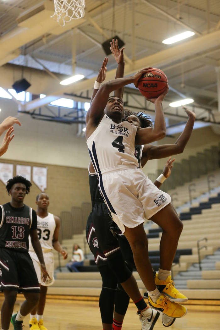 Democracy Prep’s Daniel Plumer (4) goes up for a shot against Cimarron-Memorial in the ...