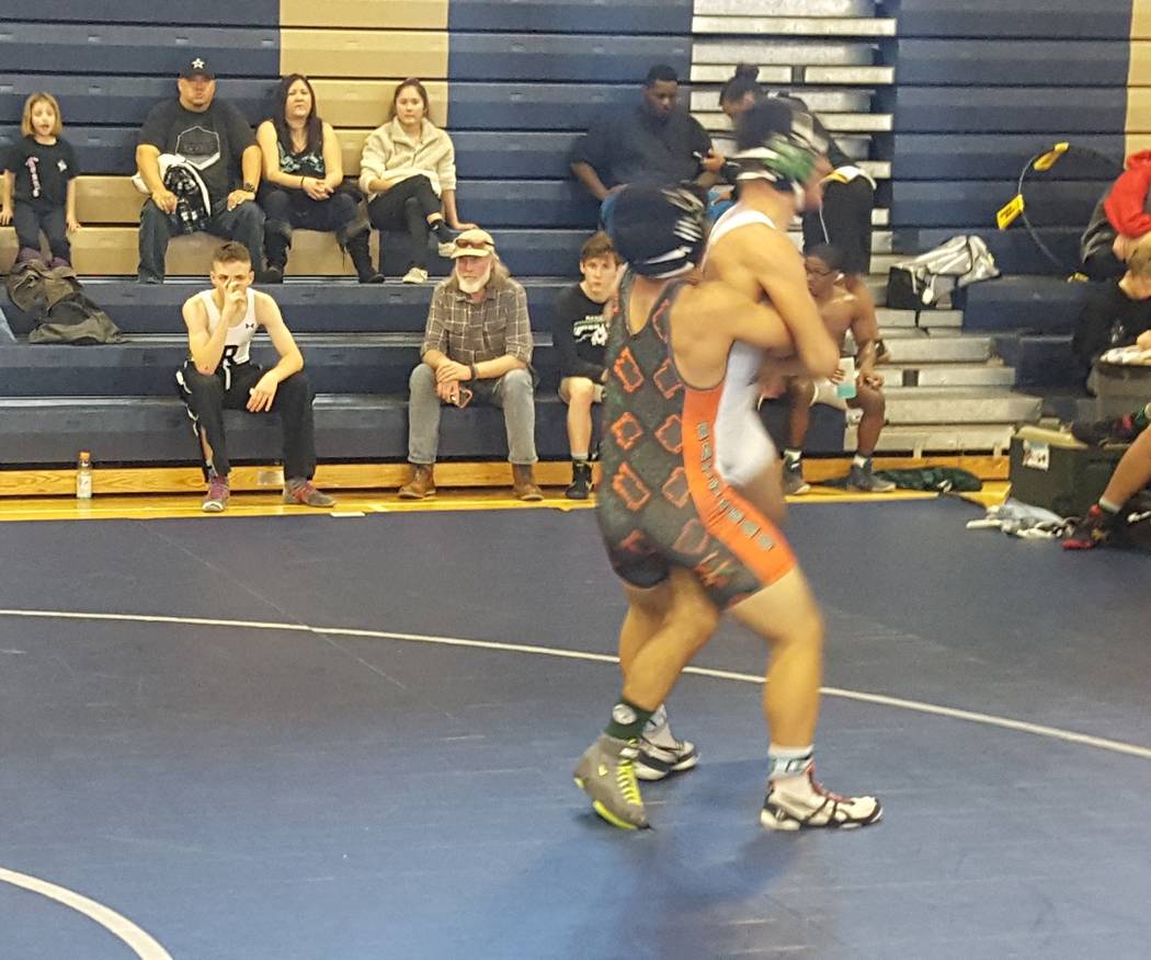 Mojave’s Jayzen Cabbab (left) prepares to throw Rancho’s Jose Rubio in the 126-p ...