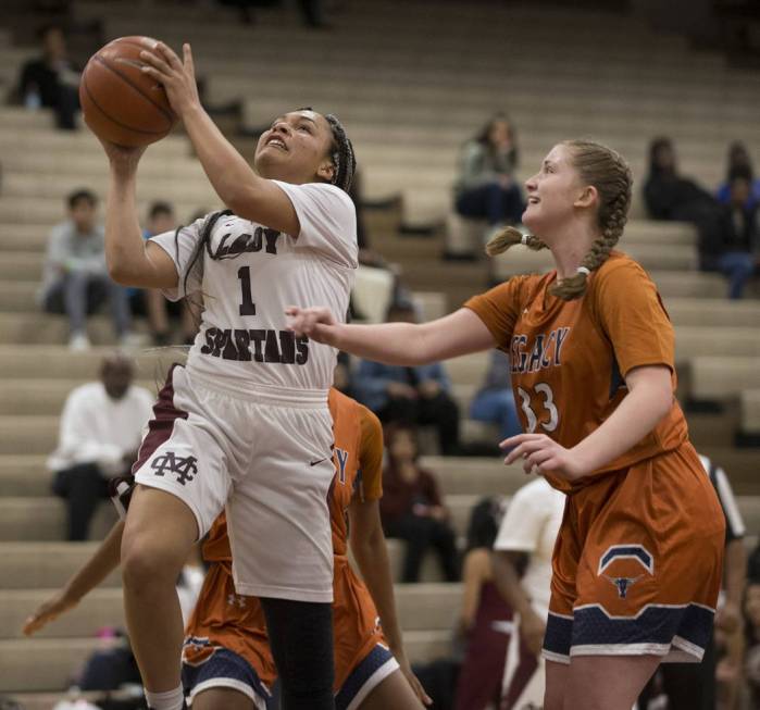 Cimarron-Memorial’s Elise Young (1) goes up for a shot against Legacy in the girls bas ...