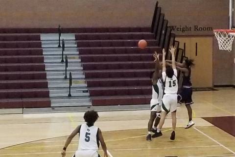 Legacy guard Rayshon Funches passes out of a trap against Fairmont (California) during the T ...