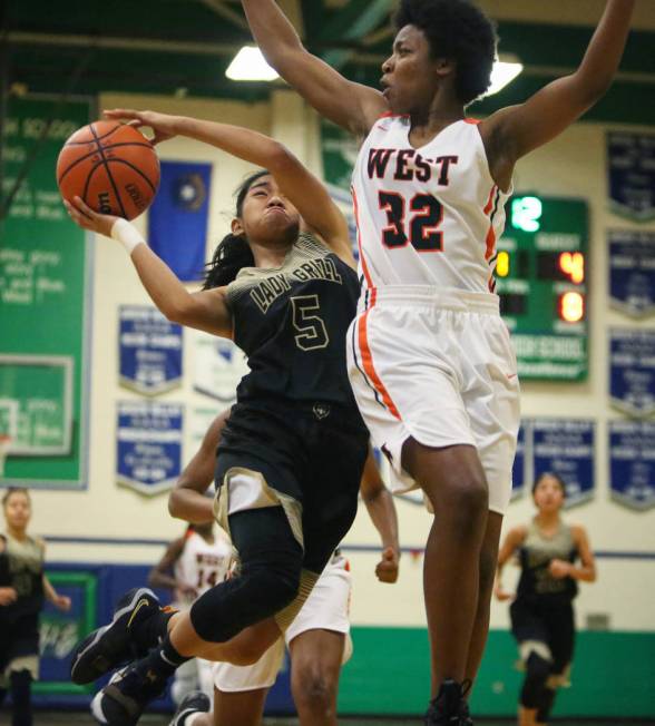 Spring Valley’s Chelsea Camara (5) drives past West Anchorage’s Ah’Kayzee ...