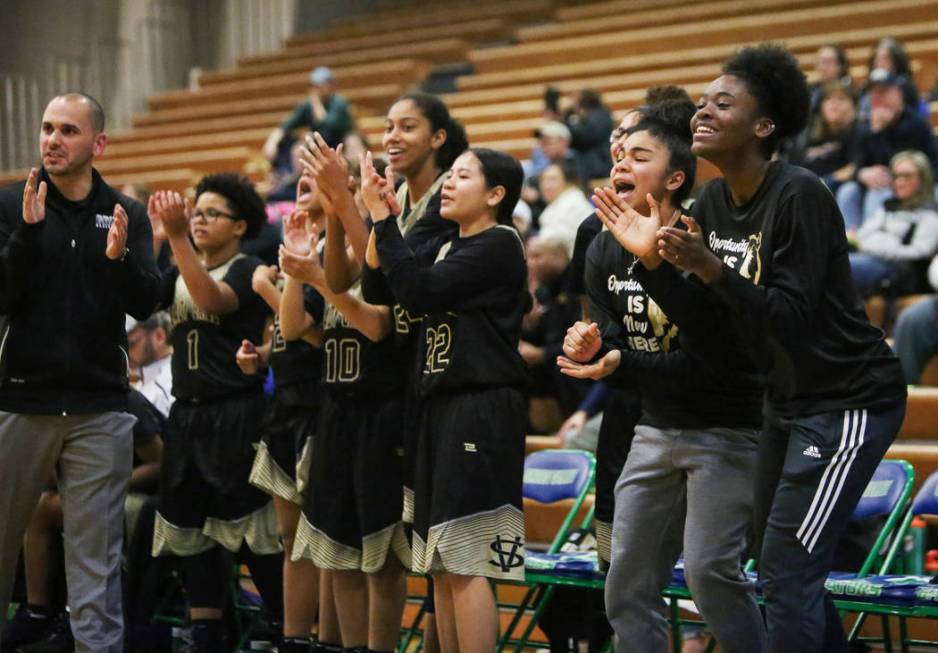 Spring Valley players on the sidelines cheer for their teammates during the second half of a ...