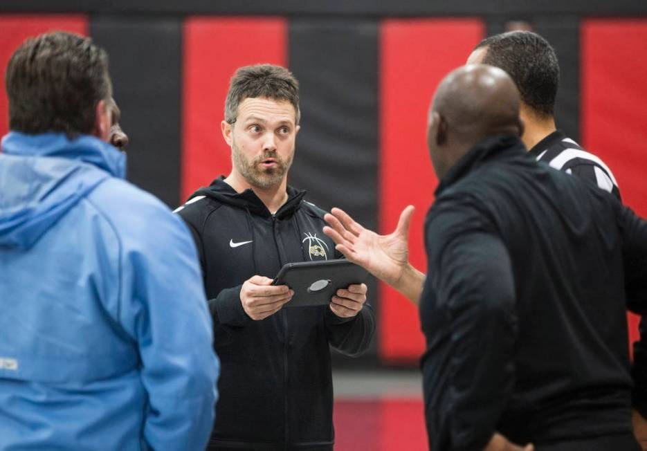 Sierra Vista head coach Eric Markuson, middle, talks to referees about the circumstances tha ...