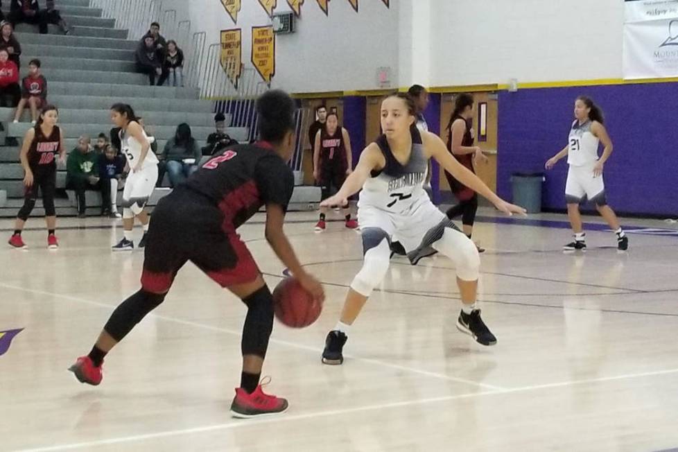 Spring Valley’s Garrisen Freeman, right, defends Liberty’s Joy Watkins on Saturd ...