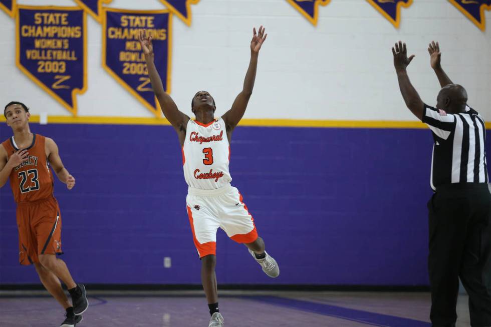 Chaparral’s Elijah Briggs (3) reacts after making a three-pot-shot against Legacy dur ...