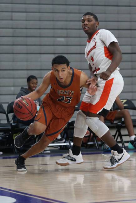 Legacy’s Andrew Garcia (23) dribbles the ball past Chaparral’s Meshach Hawkins ( ...