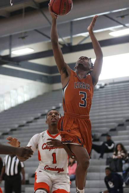 Legacy’s Rayshon Funches (3) takes a shot against Chaparral in the boy’s basketb ...