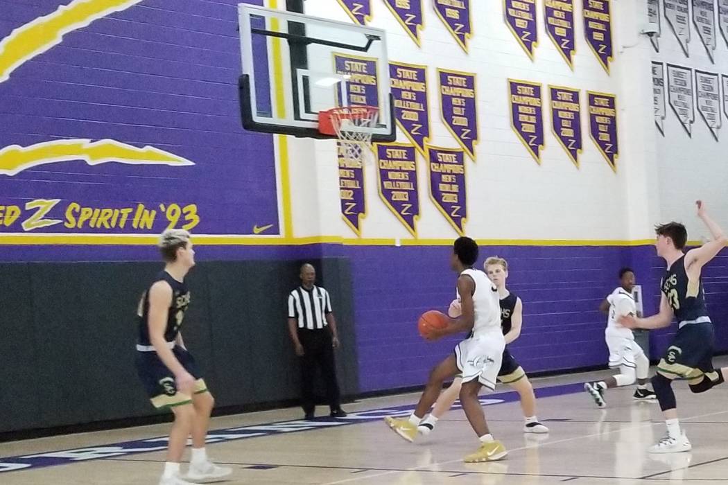 Cheyenne’s Glenn Taylor drives to the basket against Snow Canyon (Utah) on Saturday du ...