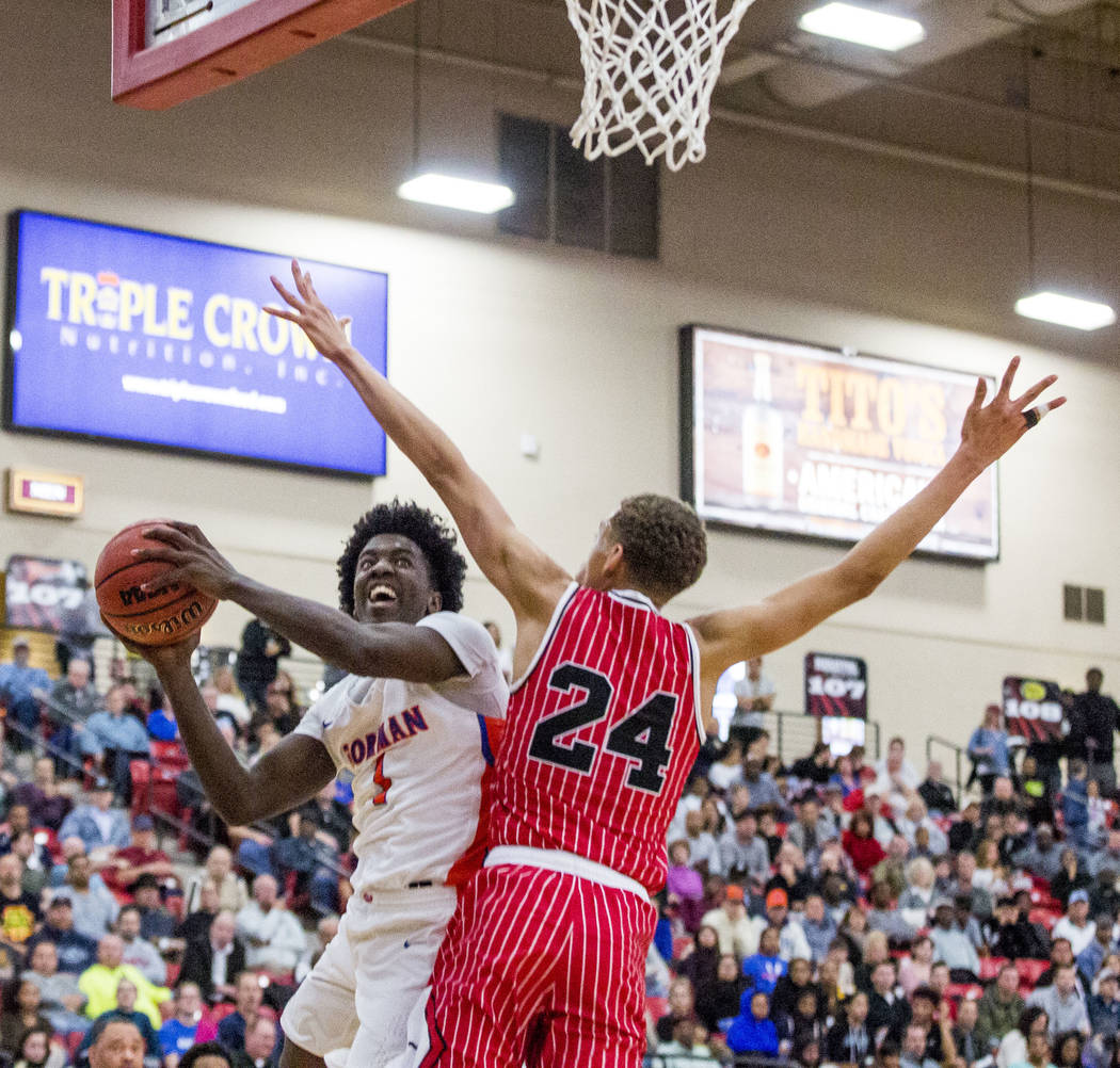 Bishop Gorman’s Will McClendon (1) looks to shoot while Findlay Prep’s Spencer W ...